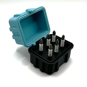 May include: A set of eight screwdriver bits in a black and blue plastic case. The case is open and the bits are arranged in a grid pattern.
