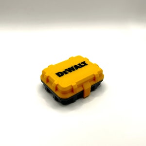 May include: A yellow plastic case with a black lid and the word "DEWALT" printed in black on the top.