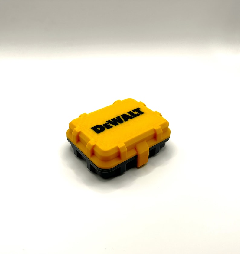 May include: A yellow plastic case with a black lid and the word "DEWALT" printed in black on the top.