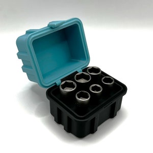 May include: A set of six silver socket wrenches in a black plastic case with a light blue lid. The case is open and the wrenches are visible.
