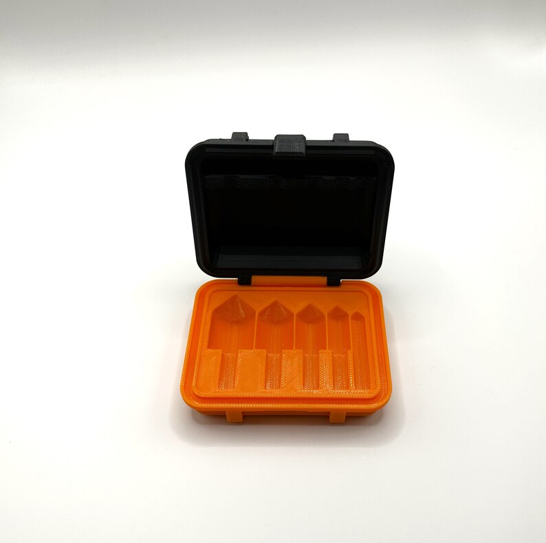 May include: An orange plastic storage case with a black lid. The case has five slots for holding small items.