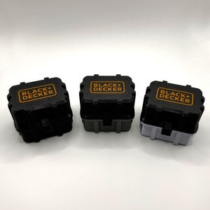 May include: Three black and gray toolboxes with the text "BLACK+DECKER" printed in orange on the top of each box.