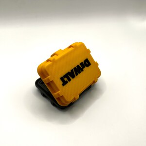 May include: A yellow plastic storage case with the word "DEWALT" printed in black letters on the top.