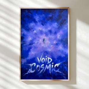 May include: A framed art print featuring a spacewalker floating in a nebula of blues and purples. The words "Void Cosmic" are written in white, stylized lettering at the bottom of the image. The artwork is framed in a light-colored wooden frame.