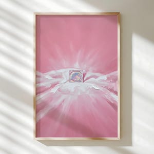 May include: Abstract art print in a wooden frame. The artwork features a pink background with white brushstrokes and a central, iridescent square. The painting evokes a sense of light and texture, with a focus on color and form.