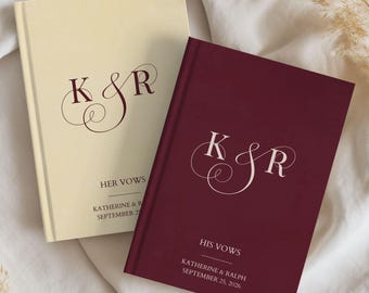May include: Two hardcover vow books with custom text. The cream book features dark red lettering reading K & R, HER VOWS, KATHERINE & RALPH, SEPTEMBER 25, 2026. The burgundy book features white lettering reading K & R, HIS VOWS, KATHERINE & RALPH, SEPTEMBER 25, 2026.