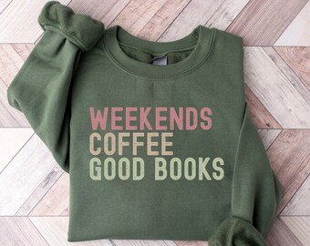 May include: A green sweatshirt with the text "Weekends Coffee Good Books" printed in pink, yellow, and green.