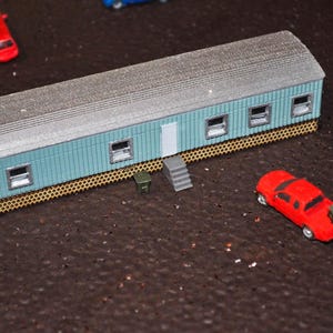 N Scale Mobile Home– Real Wood Laser-Cut Lattice Skirting – 1/160, 2 sets of steps and a garbage can.