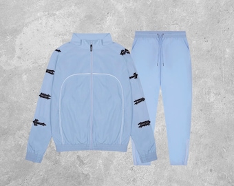 Trapstar Shellsuit - Tuta Irongate Shell Track Top 2.0 in cashmere blu nero – Set giacca e pantaloni