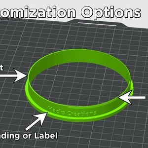 Op de afbeelding: Een felgroene ronde uitsteker met een recht mes en een scherp mes. Aan de zijkant van de uitsteker staat de tekst Hacks Creations. De afbeelding bevat labels die wijzen naar het rechte mes, het scherpe mes en de branding of het label.