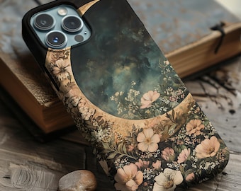 Könnte beinhalten: Eine schwarze Handyhülle mit einem Halbmond und einem floralen Design. Der Mond ist golden und die Blumen sind rosa und weiß.