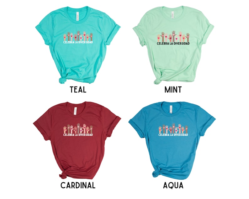 May include: Four t-shirts in teal, mint, cardinal, and aqua. Each shirt features a graphic of raised hands in various skin tones with hearts, and the text "CELEBRA LA DIVERSIDAD" in white. The shirts are short-sleeved.