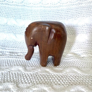 Vintage. Sculpture of a baby elephant made of solid wood, handmade. Miniature