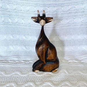 Vintage. A goat sculpture made from solid wood, handcrafted.