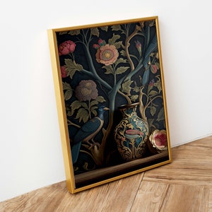 May include: A framed print of a dark blue vase with gold and red floral designs, surrounded by a dark blue and green floral pattern with two blue birds. The vase is sitting on a dark brown surface.