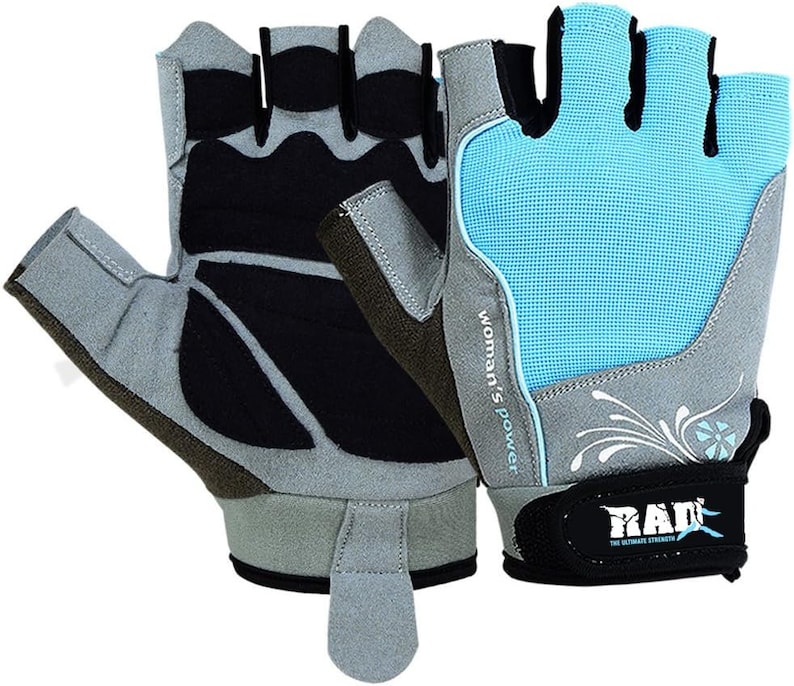 May include: A pair of fingerless gloves with a gray and black design on one glove and a light blue, gray, and white design on the other glove. The glove with the light blue design has the text "Woman's Power" and "RAD" on it.