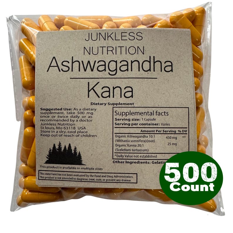 May include: A clear plastic bag filled with numerous yellow capsules. The bag has a label with the text "JUNKLESS NUTRITION Ashwagandha Kana Dietary Supplement." A green circle on the bag reads "500 Count."