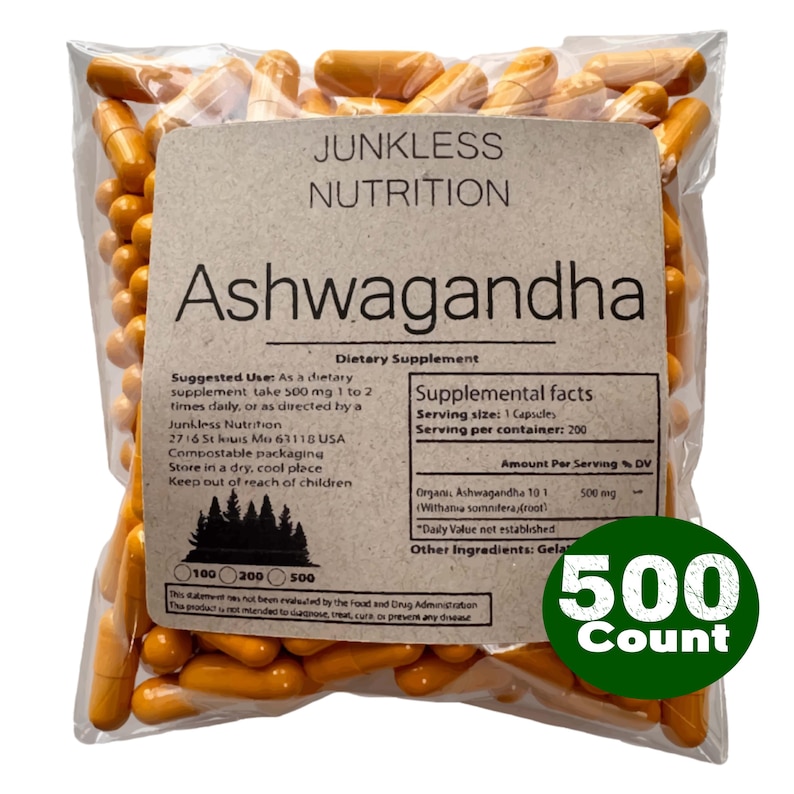 May include: A clear bag of orange capsules, labelled "Ashwagandha" by Junkless Nutrition. The label details a 500-count dietary supplement. A green sticker indicates "500 Count".