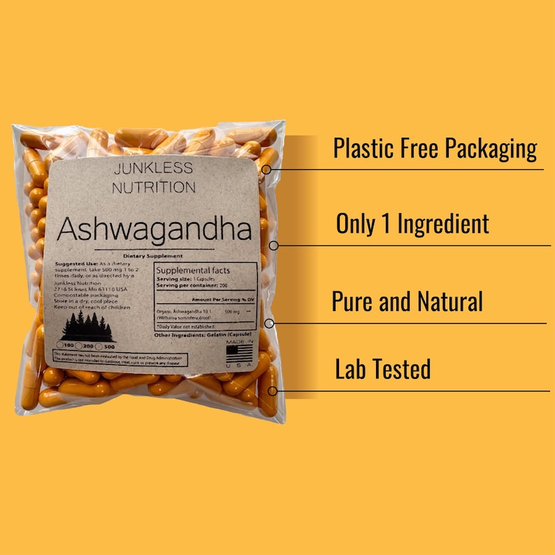 May include: A transparent bag filled with orange capsules, labelled "Ashwagandha" by Junkless Nutrition. The bag has a brown paper label with supplement facts and the text "Plastic Free Packaging, Only 1 Ingredient, Pure and Natural, Lab Tested."