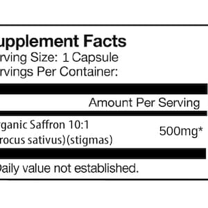 May include: A white label with black text detailing supplement facts. It lists "Organic Saffron 10:1" with 500mg per serving. The serving size is 1 capsule, and the daily value is not established.