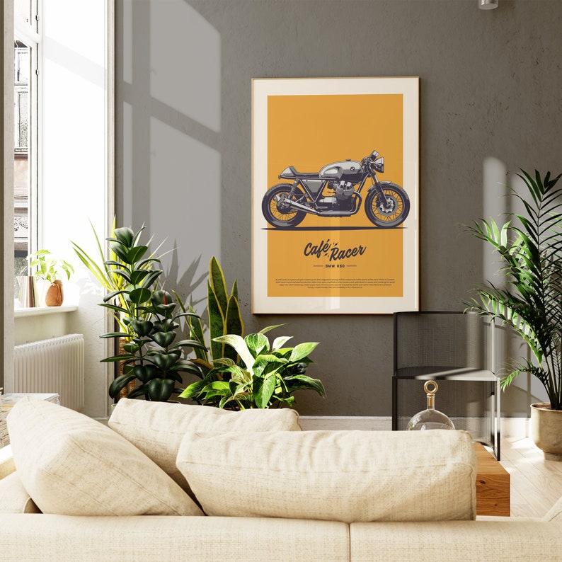 Image of a framed poster displayed on dark wall showcasing a vintage Cafe Racer Bike