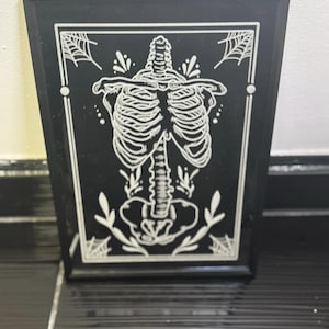 skeleton engraved mirror