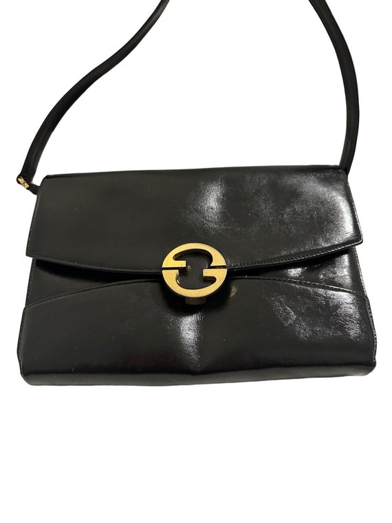 Gucci 1973 black gold logo bag