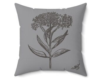 May include: Square gray throw pillow featuring a botanical illustration of a plant with a cluster of small flowers. The plant is drawn in a dark gray color. The pillow has a soft, inviting appearance, suitable for home decor.
