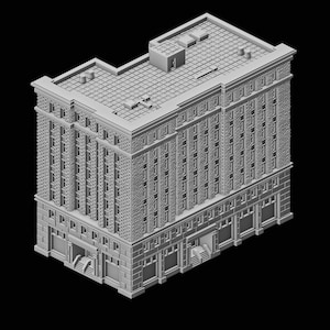 Op de afbeelding: Een gedetailleerd, grijs model van een gebouw met meerdere verdiepingen en een plat dak. Het gebouw heeft veel ramen en architectonische details, waaronder decoratieve elementen op de gevel. Het model staat tegen een zwarte achtergrond.