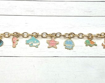 Guldfärgad emalj sommarberlockarmband