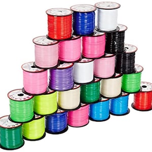 May include: A white ceramic mug with a black handle and the text "But First, Coffee" in a handwritten style. The mug is on a white surface. The mug is 4 inches tall.