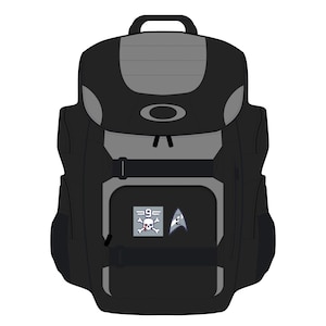 May include: Black and grey backpack with a top handle and multiple compartments. Features a front pocket with a skull and crossbones graphic and a Starfleet insignia. Includes adjustable straps and a buckle closure.