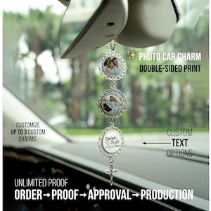 May include: A silver-toned car charm hanging from a rearview mirror, featuring three circular filigree frames. Two frames contain circular photographs of a couple, and the third frame displays the text Drive Safe I Love You with a heart icon.
