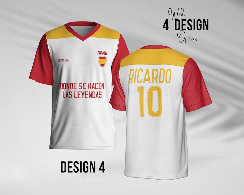 May include: White soccer jersey with red and yellow accents. The front of the jersey has the text "SPAIN" and "#EURO2024" and the text "DONDE SE HACEN LAS LEYENDAS". The back of the jersey has the text "RICARDO" and the number "10".