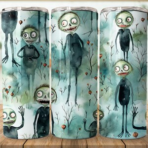 May include: Three stainless steel tumblers with a spooky Halloween design. The tumblers feature a watercolor background with a pattern of green and blue trees, red berries, and cartoon zombie characters with green skin and wide eyes.