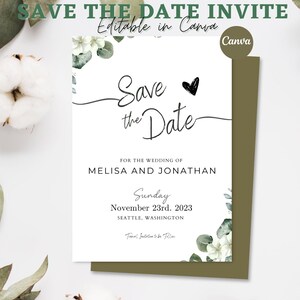 May include: Save the Date wedding invitation with white flowers and green leaves on a white background. The text reads "Save the Date" with a heart symbol and "For the wedding of Melisa and Jonathan" followed by the date "Sunday, November 23rd, 2023" and location "Seattle, Washington".
