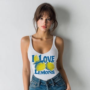 I Love Lemons t-shirt design featuring three hand-drawn yellow lemons with blue shading and bold retro blue text that says “I LOVE LEMONS.” A vibrant summer fruit graphic perfect for sublimation, printable t-shirts, summer merch, lemon-themed gifts, or wall art. Includes high-resolution PNG and PDF files for instant download. Ideal for fruit lovers, bold fashion, and sunny summer apparel.