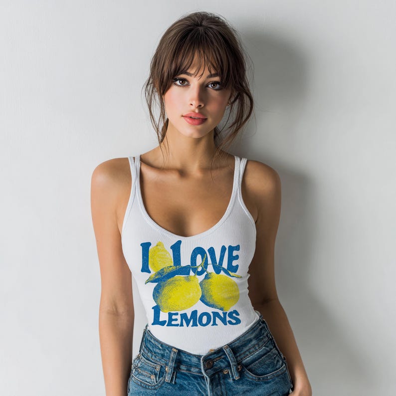 I Love Lemons t-shirt design featuring three hand-drawn yellow lemons with blue shading and bold retro blue text that says “I LOVE LEMONS.” A vibrant summer fruit graphic perfect for sublimation, printable t-shirts, summer merch, lemon-themed gifts, or wall art. Includes high-resolution PNG and PDF files for instant download. Ideal for fruit lovers, bold fashion, and sunny summer apparel.