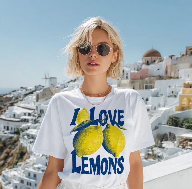 I Love Lemons t-shirt design featuring three hand-drawn yellow lemons with blue shading and bold retro blue text that says “I LOVE LEMONS.” A vibrant summer fruit graphic perfect for sublimation, printable t-shirts, summer merch, lemon-themed gifts, or wall art. Includes high-resolution PNG and PDF files for instant download. Ideal for fruit lovers, bold fashion, and sunny summer apparel.