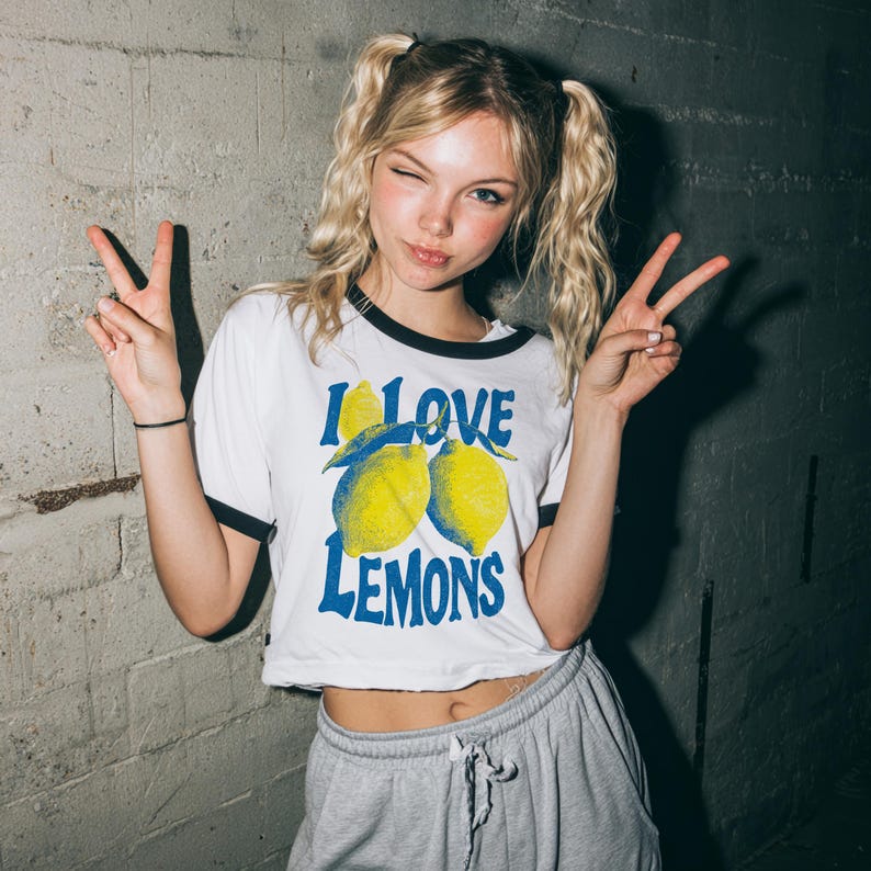 I Love Lemons t-shirt design featuring three hand-drawn yellow lemons with blue shading and bold retro blue text that says “I LOVE LEMONS.” A vibrant summer fruit graphic perfect for sublimation, printable t-shirts, summer merch, lemon-themed gifts, or wall art. Includes high-resolution PNG and PDF files for instant download. Ideal for fruit lovers, bold fashion, and sunny summer apparel. Gift for Her, gift for him.