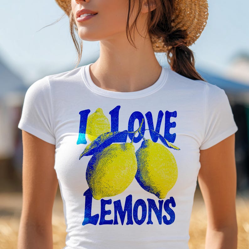 I Love Lemons t-shirt design featuring three hand-drawn yellow lemons with blue shading and bold retro blue text that says “I LOVE LEMONS.” A vibrant summer fruit graphic perfect for sublimation, printable t-shirts, summer merch, lemon-themed gifts, or wall art. Includes high-resolution PNG and PDF files for instant download. Ideal for fruit lovers, bold fashion, and sunny summer apparel.