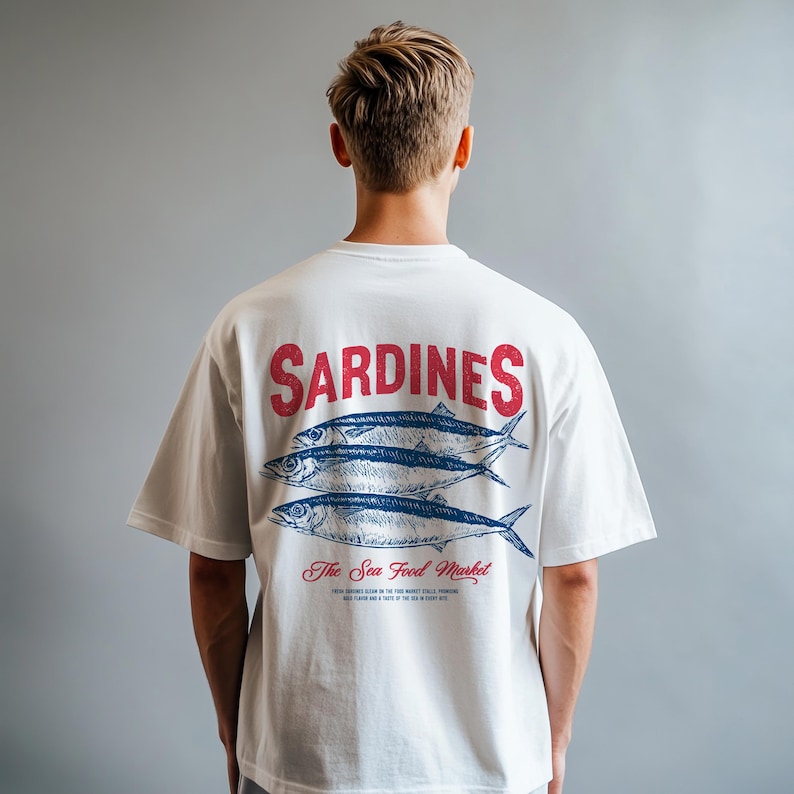 Vintage sardines illustration digital design featuring three detailed sardines with classic typography, perfect for t-shirts, mugs, wall art, kitchen decor, tote bags, and coastal home accessories. Includes 1 high-resolution PNG file with transparent background and 1 PDF file. Ideal for seafood lovers, nautical themes, ocean-inspired decor, and creative DIY projects. Perfect for printable designs celebrating seafood and coastal living.