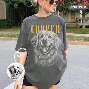 May include: Dark grey t-shirt with a detailed illustration of a Golden Retriever and the name "COOPER" in gold lettering. The shirt has a vintage, worn appearance.