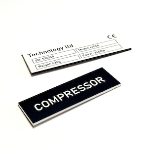 May include: Two white labels with black text. The top label reads "Technology ltd" with the following information: "SN: 100358", "Weight: 62kg", "Model: cr560", "Power: 2400w", and "CE". The bottom label is black with white text that reads "COMPRESSOR".