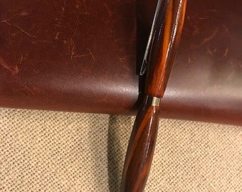 Slimline Pen in Gold &  Cocobolo Hardwood, finished with CA finish, polished to protect and show variety of the colors within woodgrain.