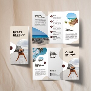 May include: A tri-fold brochure advertising travel services. The brochure features a woman in a white dress and a hat walking on a beach. The brochure has the text "Great Escape" and "voyavatravel.com" on the front cover. The brochure also features a list of popular destinations, including Spain, Portugal, Chile, Brazil, and Ecuador. The brochure also includes information about travel insurance and contact information.