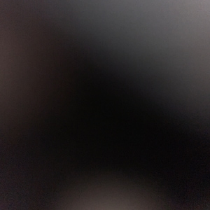 Puede incluir: Un fondo gris oscuro texturizado con un ligero degradado de gris claro a gris oscuro.