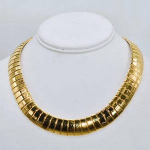 Vintage Monet High Polish Gold-Tone 16 mm Omega Statement Necklace 18 inch