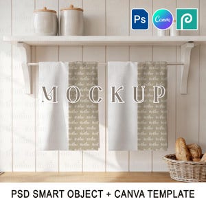 May include: A kitchen scene featuring two white towels hanging on a metal bar, with the word "MOCKUP" displayed on them. The towels are on a white shelf with two jars. The image includes the text "PSD SMART OBJECT + CANVA TEMPLATE".