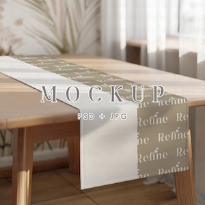 May include: A table runner mockup in neutral tones. The runner is laid on a wooden table, displaying the word "MOCKUP" and "PSD + JPG". The design incorporates the word "Refine" in a repeating pattern.